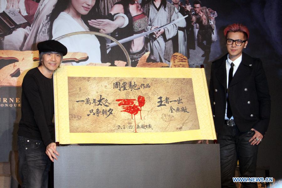 Director Stephen Chow (L) and actor Show Lo pose for photo during a press conference of the movie "Journey to the West: Conquering the Demons" in Taipei, southeast China's Taiwan, Jan. 28, 2013. The movie is expected to hit the screen on Feb. 7, 2013 in Taipei. (Xinhua)