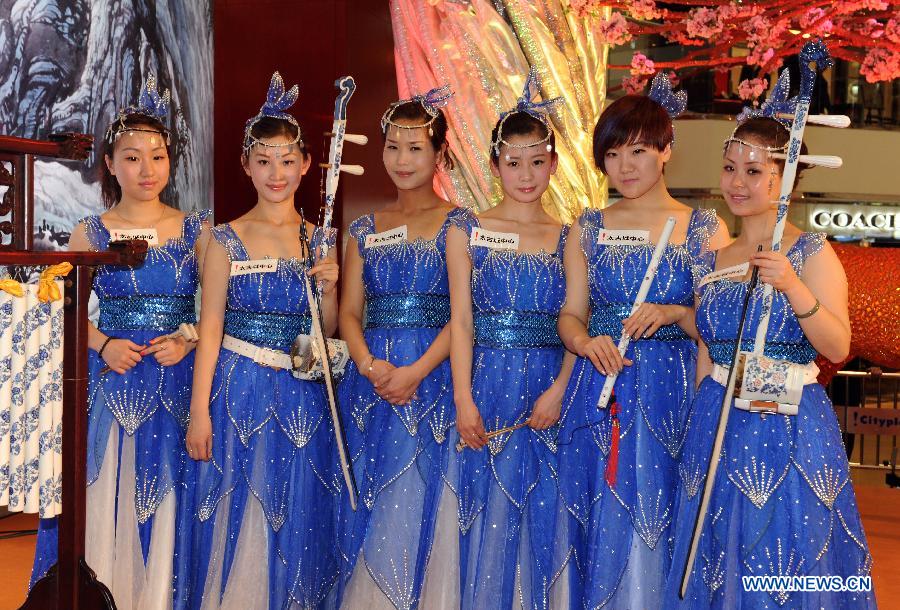 Artists pose with their ceramic music instruments after a concert in Hong Kong, south China, Jan. 30, 2013. A band from Jingdezhen, the "porcelain capital" of China, presented a concert to the people in Hong Kong with a whole set of porcelain musical instruments. (Xinhua/Wong Pun Keung)