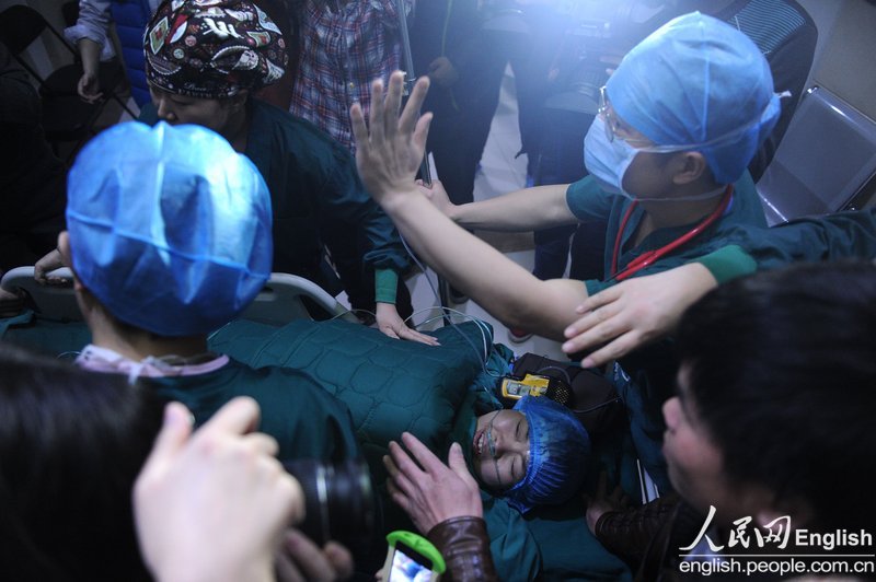 Lu Yuanfang, who has spinal muscular atrophy, gives birth to a premature boy in Beijing, Jan. 30. The birth marked a medical first in China. The mother and the son remain in the hospital under close observation.  (Photo/CFP) 