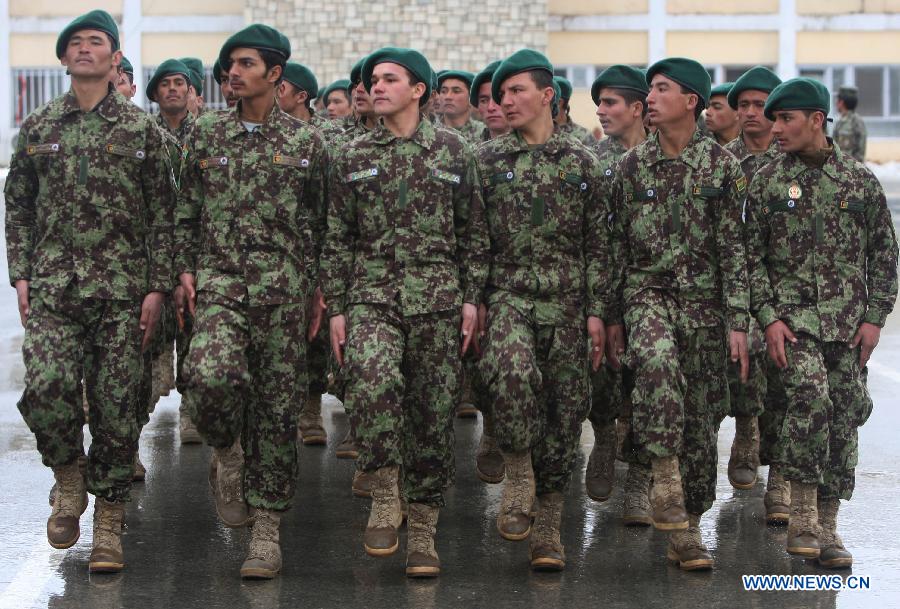 Afghan soldiers march during their graduation ceremony at the National Army Training center in Kabul, Afghanistan on Jan. 31, 2013. A total of 1,400 soldiers graduated from Kabul Military Training Center (KMTC) on Thursday and were commissioned to Afghan National Army (ANA), General Aminullah Patyannai, commander of KMTC said. (Xinhua/Farid) 