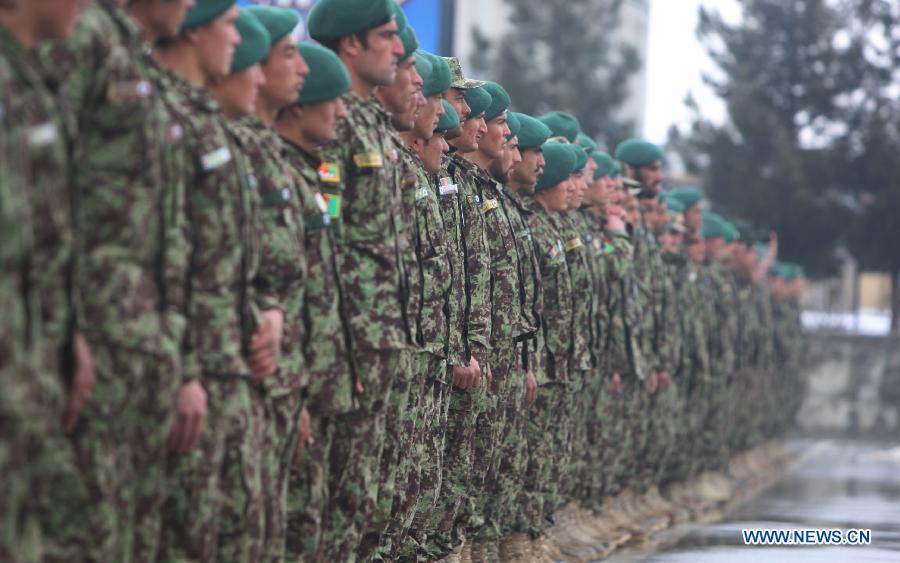 Afghan soldiers attend their graduation ceremony at the National Army Training center in Kabul, Afghanistan on Jan. 31, 2013. A total of 1,400 soldiers graduated from Kabul Military Training Center (KMTC) on Thursday and were commissioned to Afghan National Army (ANA), General Aminullah Patyannai, commander of KMTC said. (Xinhua/Farid) 