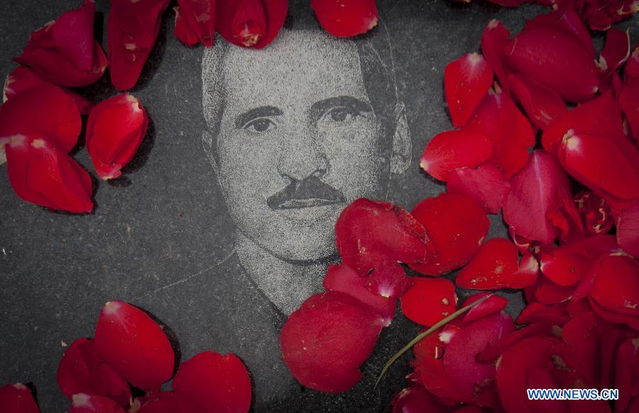 A portrait of an Iranian man, who was killed during the 1979 Islamic revolution, is seen on the grave at the Behesht-e Zahra cemetery outside Tehran, Iran, on Jan. 31, 2013. Iran started Thursday to celebrate the 34th anniversary of the 1979 Islamic revolution. (Xinhua/Ahmad Halabisaz) 