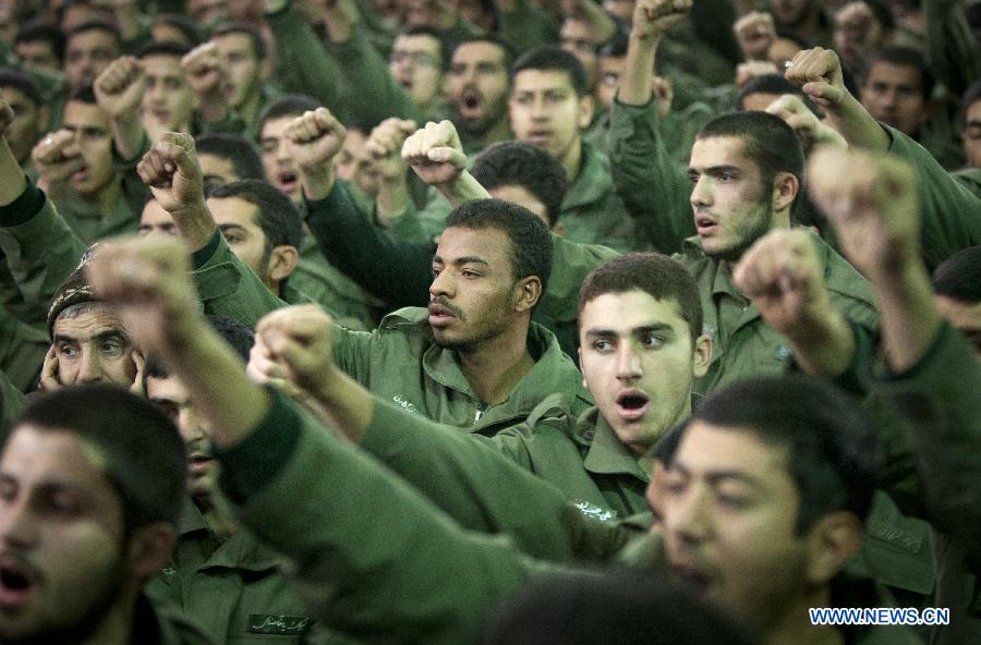 Iranian soldiers shout slogans in Iran's late Islamic revolution leader Ayatollah Khomeini' shrine, in Tehran, Iran, Jan. 31, 2013, during a ceremony marking the time when he returned to Tehran, on Jan. 31, 1979 from 14 years of exile in Paris. Iran started Thursday to celebrate the 34th anniversary of the 1979 Islamic revolution. (Xinhua/Ahmad Halabisaz)