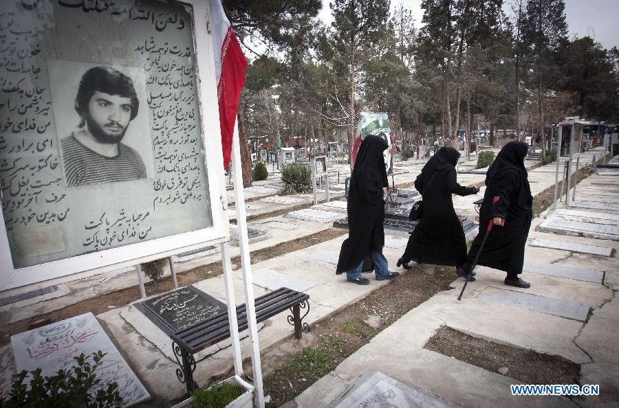 Iranian women visit the graves of people who were killed during the 1979 Islamic revolution at the Behesht-e Zahra cemetery outside Tehran, Iran, on Jan. 31, 2013, to mark the 34th anniversary of the Islamic revolution. (Xinhua/Ahmad Halabisaz) 