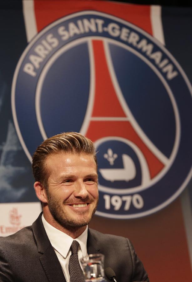 Soccer player David Beckham arrives for a news conference in Paris January 31, 2013. (Photo: Xinhua/Reuters)