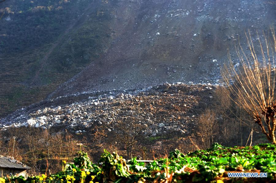 Photo taken on Feb. 1, 2013 shows the mountain landslides at Zhongtun Township in Zhenxiong County, southwest China's Yunnan Province. A landslide destroyed 35 houses, damaged 928 others and affected the lives of 712 people here. All villagers who were affected by the landslide have been relocated, the county government said. No casualties have been reported. (Xinhua/Qin Qing)