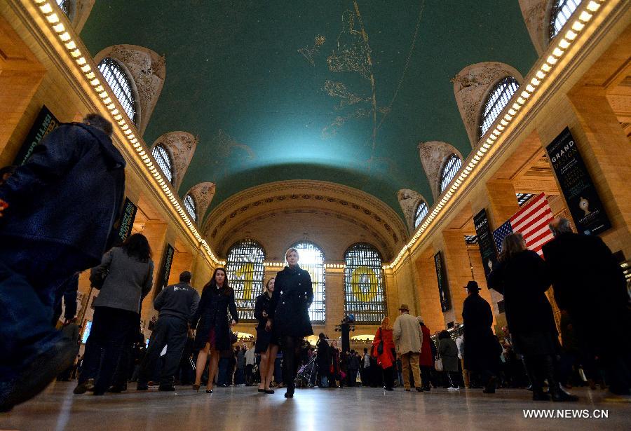 Commuters walk inside Grand Central Terminal in New York on Feb. 1, 2013. Grand Central Terminal, the New York city's landmark, turned 100 years old on Friday. (Xinhua/Wang Lei)