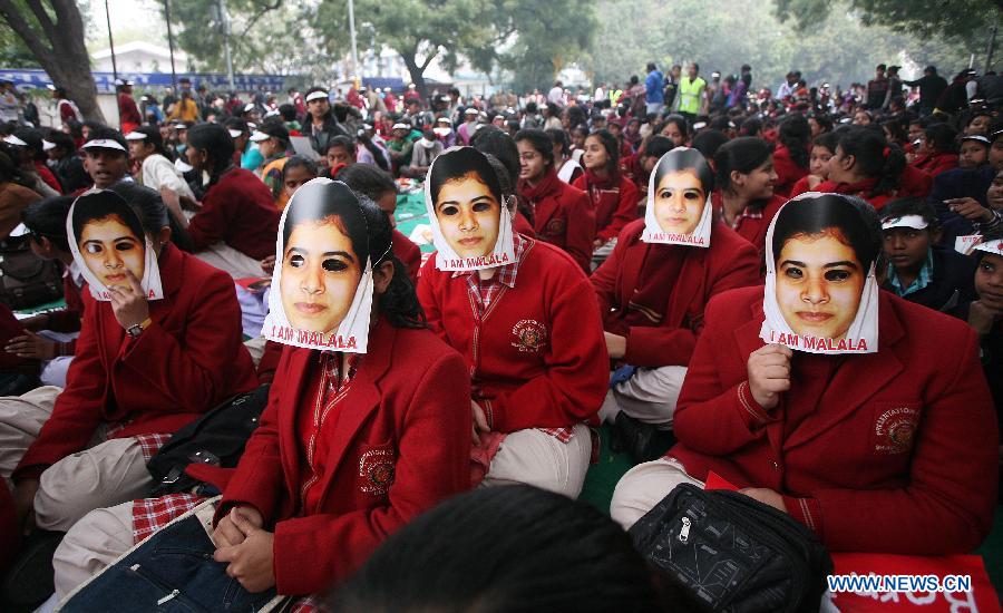 Indian students wear masks of Malala Yousufzai, a 15-year-old girl who was shot at close range in the head by a Taliban gunman in Pakistan, during a campaign to demand better budgetary allocation for health and education of Indian children in New Delhi, India, Feb. 2, 2013. (Xinhua/Partha Sarkar) 