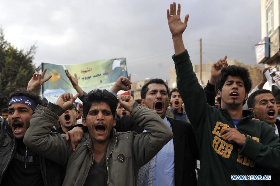 Protestors shout slogans during a demonstration requiring the government to provide medical treatment to protestors who were wounded during the 2011 uprising in Sanaa, Yemen, on Feb. 3, 2013. (Xinhua/Mohammed Mohammed)