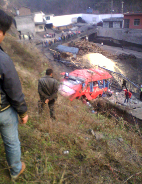 A photo taken on Feb. 1 shows an accident scene in Sichuan province. A coach flipped over into a 100-meter-deep roadside slope and 11 onboard were killed. Road accidents have claimed about 60 lives from Jan. 31 to Feb. 1. The fatal accidents shocked the whole country as hundreds of millions of Chinese journeyed home amid the Spring Festival travel rush that started on Jan. 26. (Photo/Xinhua)