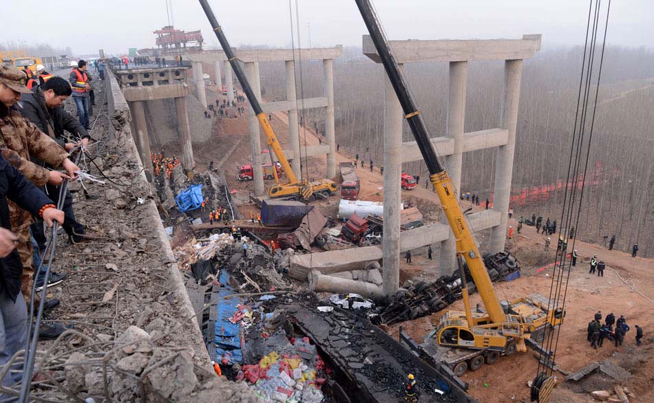 A photo taken on Feb. 1 shows the accident scene after a bridge partially collapsed due to a massive firework explosion in Sanmenxia city, central China’s Henan province, Feb. 1. Road accidents have claimed about 60 lives from Jan. 31 to Feb. 1. The fatal accidents shocked the whole country as hundreds of millions of Chinese journeyed home amid the Spring Festival travel rush that started on Jan. 26. (Photo/Xinhua)