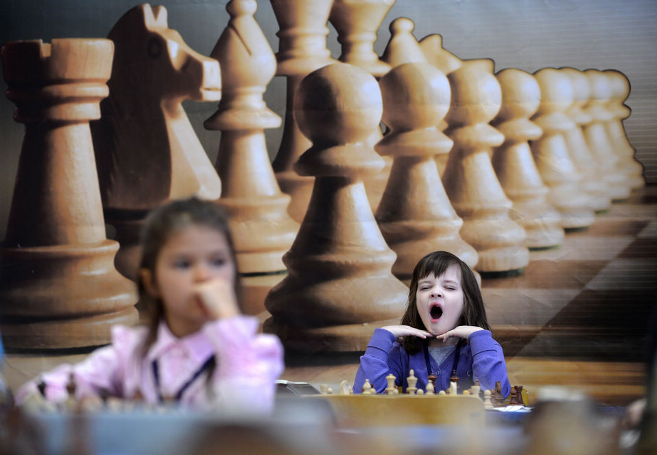 Little girls play chess as they take part in the Moscow Open 2013 Chess Festival in Moscow. More than 700 players signed to participate in the $113,000 Chess Festival on Feb.1, 2013.(Xinhua News Agency/AFP)