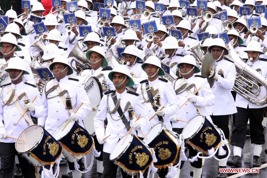 Police band participate in a military parade to celebrate Sri Lanka's 65th Independence Day in Trincomalee, Sri Lanka, Feb. 4, 2013.(Xinhua/Pushpika Karunaratne)