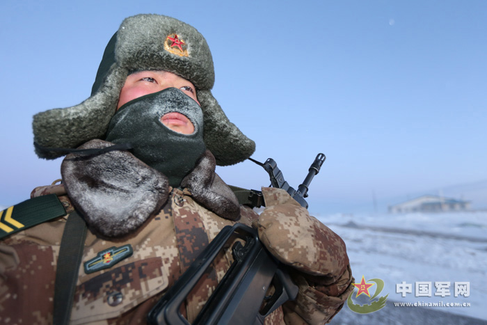 The officers and men of the Changbai Mountains Sentry Post of the No.1 Company of a frontier defense regiment under the Jilin Provincial Military Command (PMC) of the Chinese People's Liberation Army (PLA) conduct a 3-kilometer-long foot patrol in a temperature of 30 degrees below zero at 05:40 on January 18, 2013. (China Military Online/Mo Fei, Zhang Lei)  