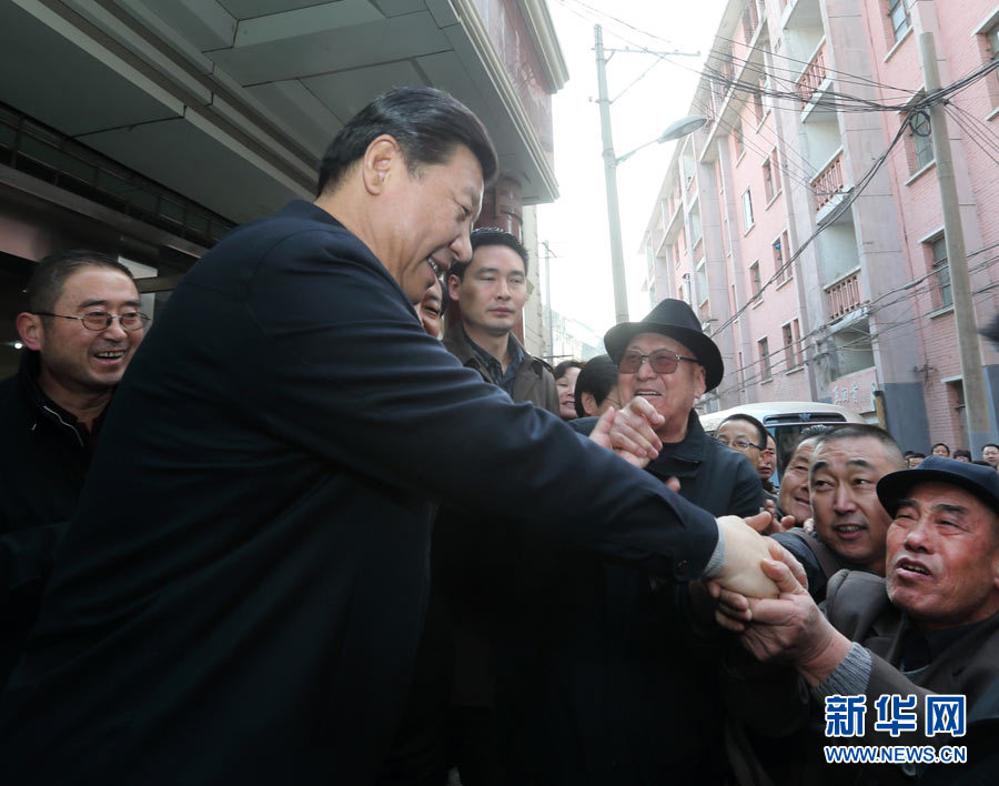 Xi Jinping, general secretary of the Central Committee of the Communist Party of China (CPC) and also chairman of the CPC Central Military Commission, shakes hands with local citizens as he visits Xihu Street of Qilihe District in Lanzhou, capital of northwest China's Gansu Province, Feb. 4, 2013. Xi Jinping visited villages, enterprises and urban communities, chatting with impoverished villagers and asking about their livelihood during an inspection tour to Gansu from Feb. 2 to 5. During his visit, Xi also extended Spring Festival greetings to all Chinese people as the Spring Festival, or the Chinese Lunar New Year, approaches. (Xinhua/Lan Hongguang)