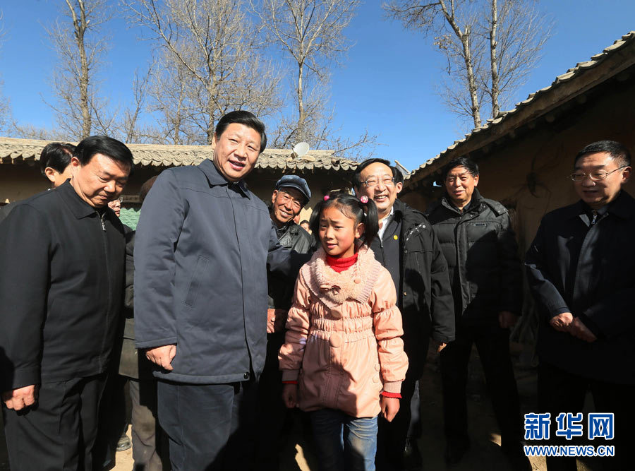 Xi Jinping, general secretary of the Central Committee of the Communist Party of China (CPC) and also chairman of the CPC Central Military Commission, chats with a girl during his visit to the Yuangudui Village of the Weiyuan County in Dingxi, northwest China's Gansu Province, Feb. 3, 2013. Xi Jinping visited villages, enterprises and urban communities, chatting with impoverished villagers and asking about their livelihood during an inspection tour to Gansu from Feb. 2 to 5. During his visit, Xi also extended Spring Festival greetings to all Chinese people as the Spring Festival, or the Chinese Lunar New Year, approaches. (Xinhua/Lan Hongguang)