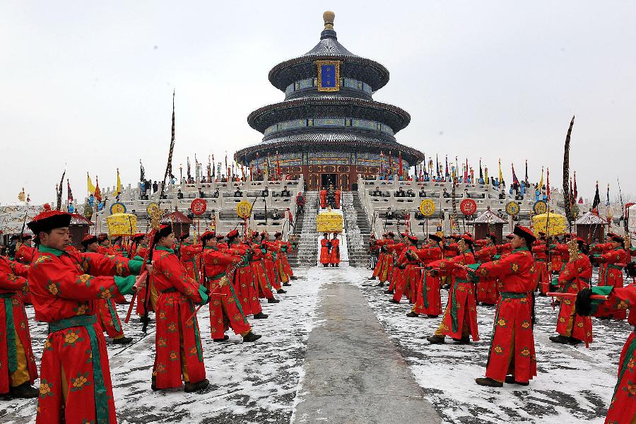 Performers dressed in costumes of the Qing Dynasty (1644-1911) act during a rehearsal of a performance presenting the ancient royal ritual to worship heaven at the Temple of Heaven in Beijing, capital of China, Feb. 5, 2013. (Xinhua/He Junchang) 