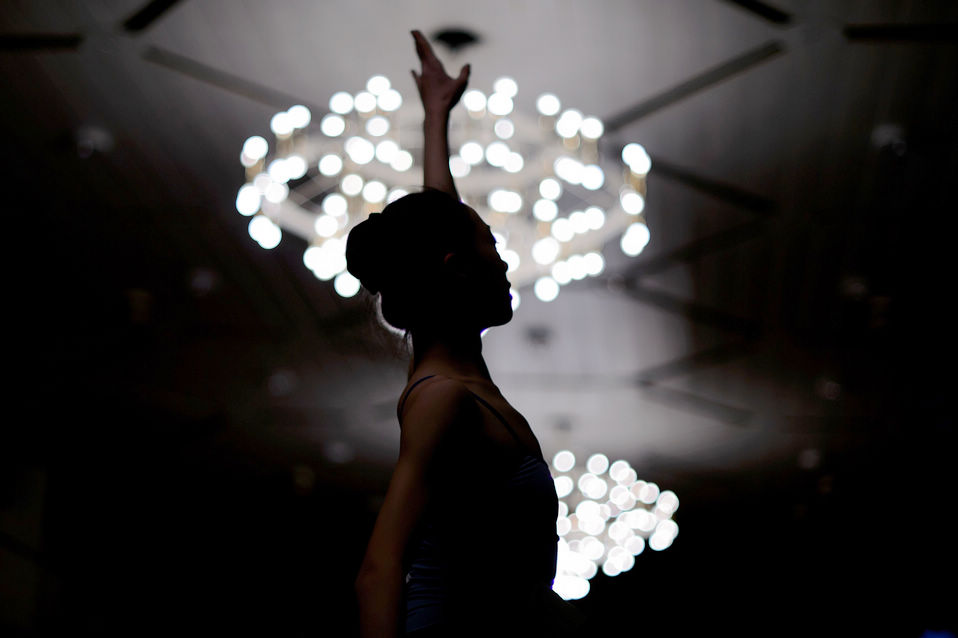 A young dancer takes part in the 41st international ballet competition in Lausanne, Switzerland, Jan. 28, 2013. (Xinhua/AFP)
