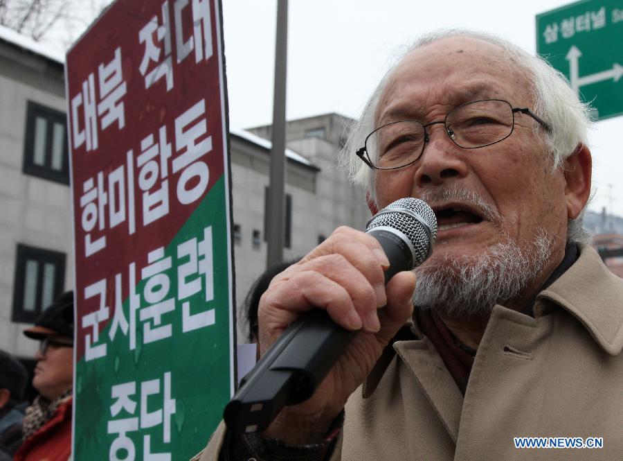 A South Korean activist speaks during a demonstration to protest against the joint naval military drill between South Korea and the United States in Seoul, South Korea, Feb. 5, 2013. South Korea and the United States launched a three-day joint naval military drill Monday in a show of force as speculation abounds over a potential nuclear test by the Democratic People's Republic of Korea (DPRK). (Xinhua/Park Jin-hee)