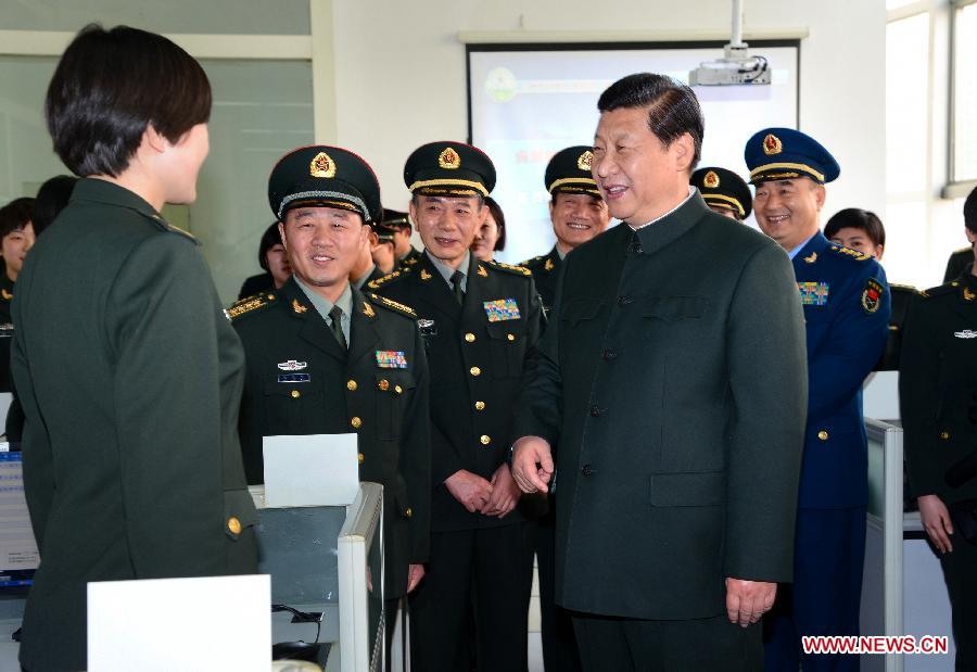 Xi Jinping (R, front), general secretary of the Communist Party of China (CPC) Central Committee and chairman of the CPC Central Military Commission (CMC), visits servicewomen of a communications regiment of the Lanzhou Military Area Command on Feb. 4, 2013. Xi Jinping visited troops stationed in the nation's northwest ahead of the lunar new year, extending festival greetings and stressing frugality in the army. (Xinhua/Li Gang) 