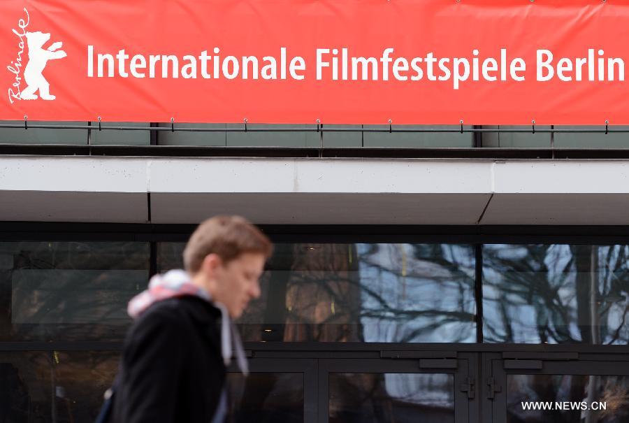 People walk past the posters of the upcoming 63rd Berlinale film festival in Berlin, capital of Germany, Feb. 6, 2013. The 63rd Berlinale film festival is scheduled to be held from Feb. 7 to 17. (Xinhua/Ma Ning)