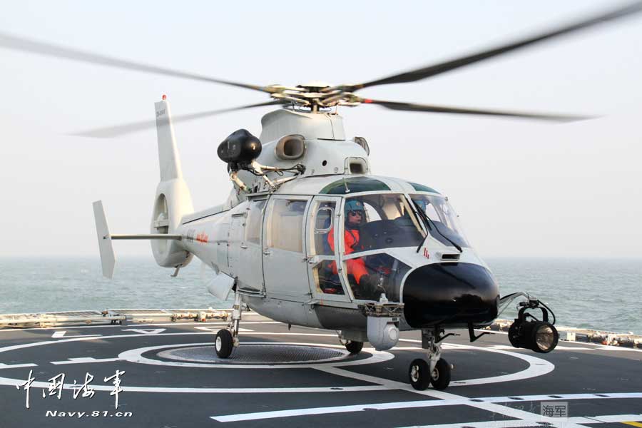 A ship-borne aircraft troop unit of the aviation force under the North China Sea Fleet of the Navy of the Chinese People's Liberation Army (PLA) successfully completed high-intensity landing training for twelve uninterrupted hours recently for the first time and greatly enhanced troop unit's capabilities of ship-helicopter coordination as well as diversified-task performing under complicated weather conditions. (China Military Online/Hu Baoliang)