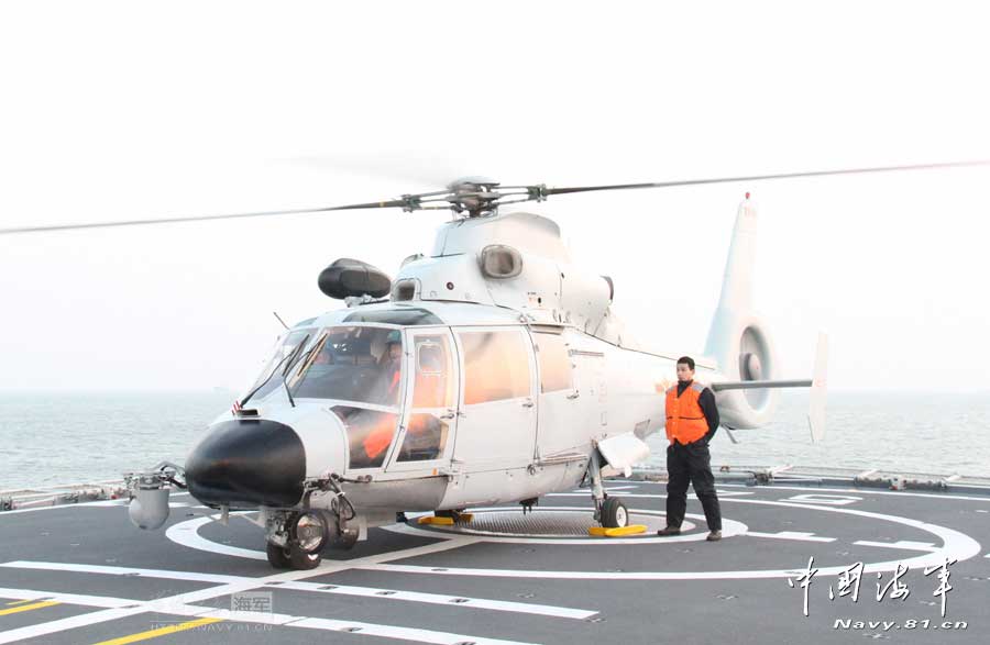 A ship-borne aircraft troop unit of the aviation force under the North China Sea Fleet of the Navy of the Chinese People's Liberation Army (PLA) successfully completed high-intensity landing training for twelve uninterrupted hours recently for the first time and greatly enhanced troop unit's capabilities of ship-helicopter coordination as well as diversified-task performing under complicated weather conditions. (China Military Online/Hu Baoliang)