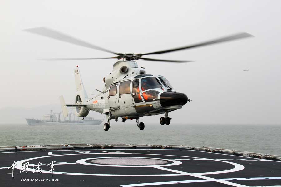 A ship-borne aircraft troop unit of the aviation force under the North China Sea Fleet of the Navy of the Chinese People's Liberation Army (PLA) successfully completed high-intensity landing training for twelve uninterrupted hours recently for the first time and greatly enhanced troop unit's capabilities of ship-helicopter coordination as well as diversified-task performing under complicated weather conditions. (China Military Online/Hu Baoliang)