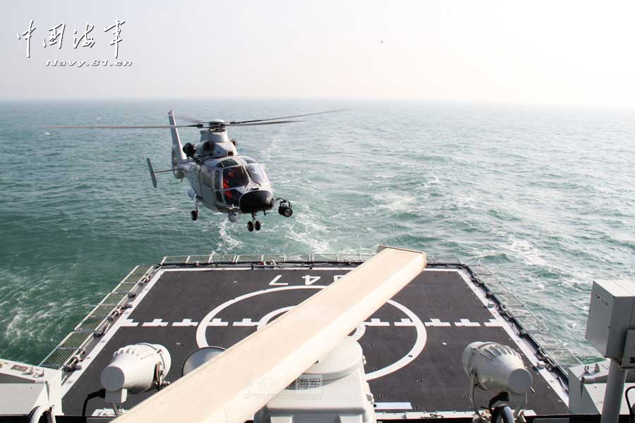 A ship-borne aircraft troop unit of the aviation force under the North China Sea Fleet of the Navy of the Chinese People's Liberation Army (PLA) successfully completed high-intensity landing training for twelve uninterrupted hours recently for the first time and greatly enhanced troop unit's capabilities of ship-helicopter coordination as well as diversified-task performing under complicated weather conditions. (China Military Online/Hu Baoliang)