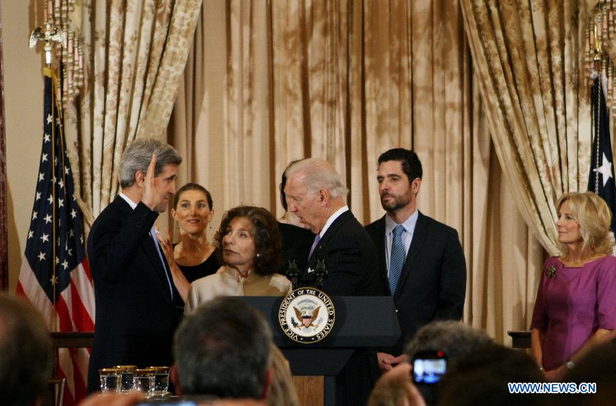 U.S. Secretary of State John Kerry (1st L) is sworn in by U.S. Vice President Joe Biden (3rd R) during a ceremonial event in Washington D.C., the United States, Feb. 6, 2013. (Xinhua/Fang Zhe) 