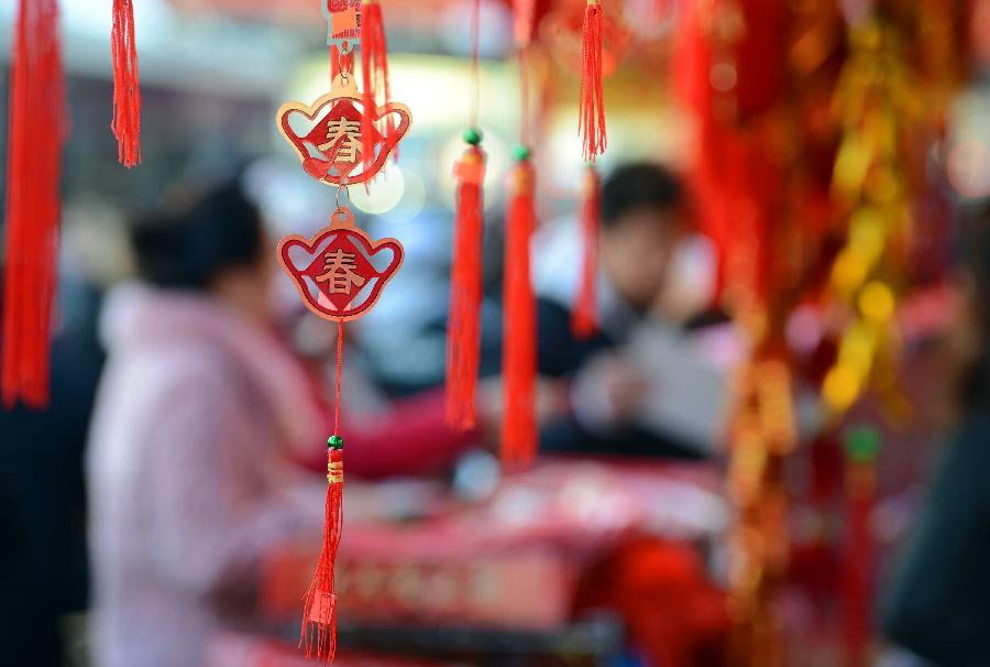 Traditional decorations for the upcoming Chinese Lunar New Year are on sale in China Town, New York, the United States, Feb. 6, 2013. The Chinese Lunar New Year, or Spring Festival, starts on Feb. 10 this year. (Xinhua/Wang Lei)  