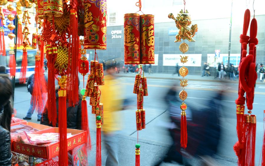 Traditional decorations for the upcoming Chinese Lunar New Year are on sale in China Town, New York, the United States, Feb. 6, 2013. The Chinese Lunar New Year, or Spring Festival, starts on Feb. 10 this year. (Xinhua/Wang Lei)  