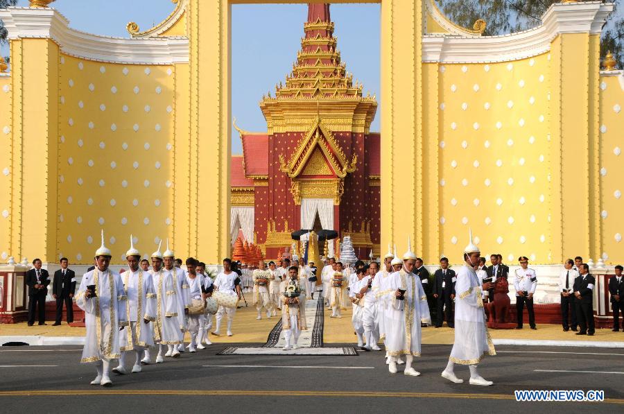 Part of the ashes of Cambodia's late King Father Norodom Sihanouk are carried out of the cremation tower during a procession in Phnom Penh, Cambodia, Feb. 7, 2013. A week-long royal funeral of Cambodia's late King Norodom Sihanouk came to an end on Thursday when part of his cremains were taken from the cremation site to keep in the royal palace in a procession. (Xinhua/Zhao Yishen)