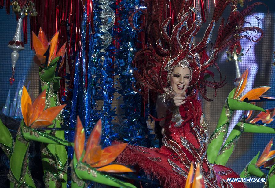 A contestant performs during the Carnival Queen pageant in Santa Cruz, Spain, Feb. 6, 2013. (Xinhua/Xie Haining)