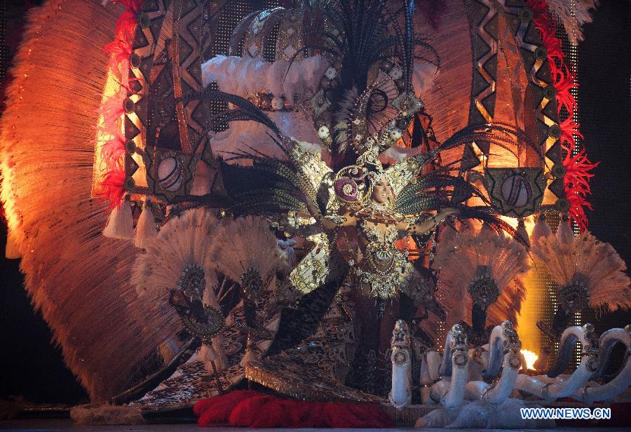 A contestant performs during the Carnival Queen pageant in Santa Cruz, Spain, Feb. 6, 2013. (Xinhua/Xie Haining)