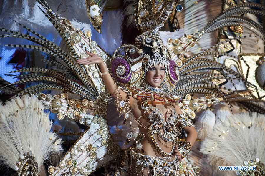 A contestant performs during the Carnival Queen pageant in Santa Cruz, Spain, Feb. 6, 2013. (Xinhua/Xie Haining)