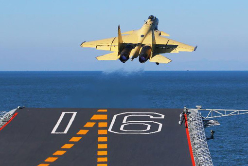 China conducts flight landing on first aircraft carrier 