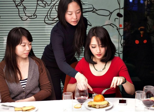 Ladies in the etiquette training. (Photo/Xinhua)