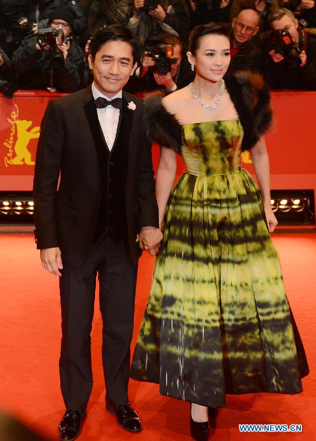 Chinese actor Tony Leung (L) and Chinese actress Zhang Ziyi arrive on the red carpet for the opening ceremony of the 63rd Berlin film festival in Berlin, Germany, on Feb. 7, 2013. The 63rd Berlin film festival opened Thursday with a martial arts epic "The grandmaster" of Chinese director Wong Kar Wai who will also lead the jury of this Berlinale. (Xinhua/Ma Ning)