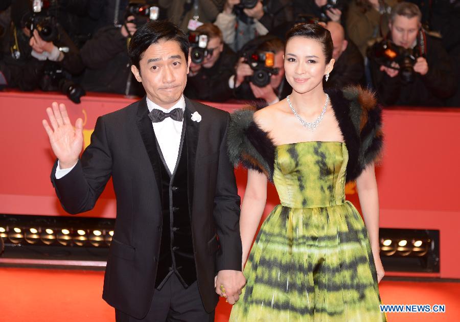 Chinese actor Tony Leung (L) and Chinese actress Zhang Ziyi arrive on the red carpet for the opening ceremony of the 63rd Berlin film festival in Berlin, Germany, on Feb. 7, 2013. The 63rd Berlin film festival opened Thursday with a martial arts epic "The grandmaster" of Chinese director Wong Kar Wai who will also lead the jury of this Berlinale. (Xinhua/Ma Ning)