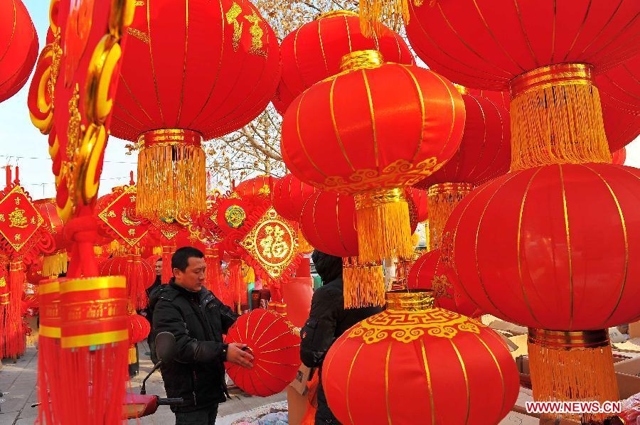 People select red lanterns for the coming Spring Festival in Qingzhou City, east China's Shandong Province, Feb. 8, 2013. The Spring Festival, the most important occasion for the family reunion for the Chinese people, falls on the first day of the first month of the traditional Chinese lunar calendar, or Feb. 10 this year. (Xinhua/Wang Jilin)