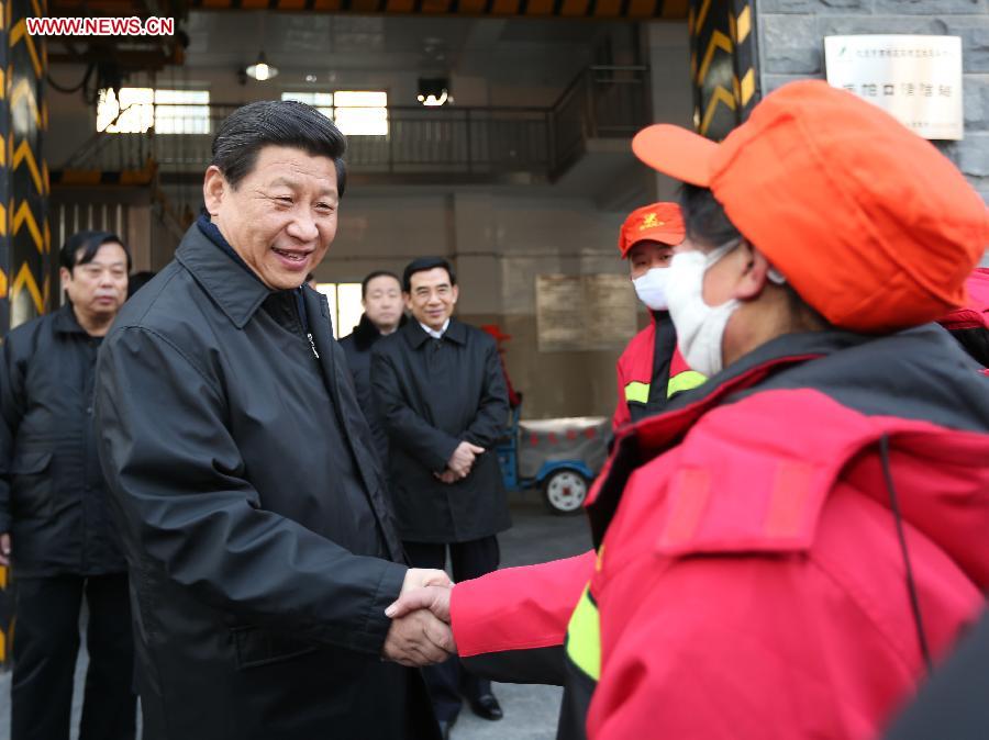 Xi Jinping (L Front), general secretary of the Communist Party of China (CPC) Central Committee and chairman of the CPC Central Military Commission, meets with sanitation workers in the Shoupakou cleaning station of the sanitation center of the Xicheng District in Beijing, capital of China, Feb. 8, 2013. Xi Jinping on Friday visited and extended greetings to laborers including subway construction workers, sanitation workers, police officers and taxi drivers in Beijing, ahead of the Chinese traditional Spring Festival, which starts on Feb. 10 this year. (Xinhua/Liu Weibing) 