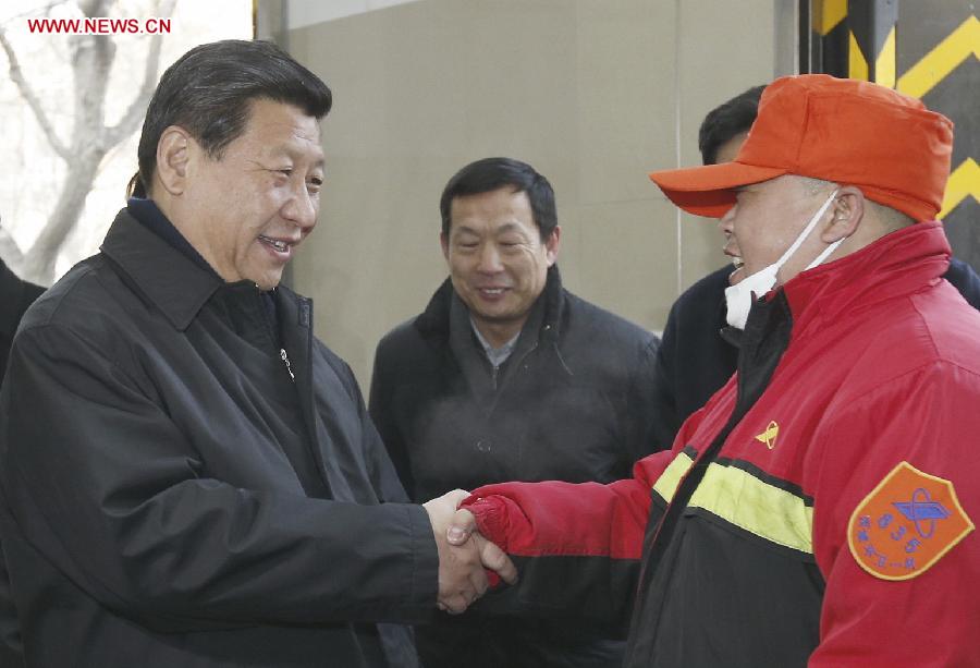 Xi Jinping (L), general secretary of the Communist Party of China (CPC) Central Committee and chairman of the CPC Central Military Commission, shakes hands with a sanitation worker in the Shoupakou cleaning station of the sanitation center of the Xicheng District in Beijing, capital of China, Feb. 8, 2013. Xi Jinping on Friday visited and extended greetings to laborers including subway construction workers, sanitation workers, police officers and taxi drivers in Beijing, ahead of the Chinese traditional Spring Festival, which starts on Feb. 10 this year. (Xinhua/Ju Peng) 