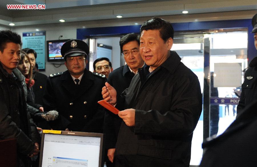 Xi Jinping (R), general secretary of the Communist Party of China (CPC) Central Committee and chairman of the CPC Central Military Commission, visits policemen at the Changqiao Police Station in the Xicheng District of Beijing, capital of China, Feb. 8, 2013. Xi Jinping on Friday visited and extended greetings to laborers including subway construction workers, sanitation workers, police officers and taxi drivers in Beijing, ahead of the Chinese traditional Spring Festival, which starts on Feb. 10 this year. (Xinhua/Liu Jiansheng) 