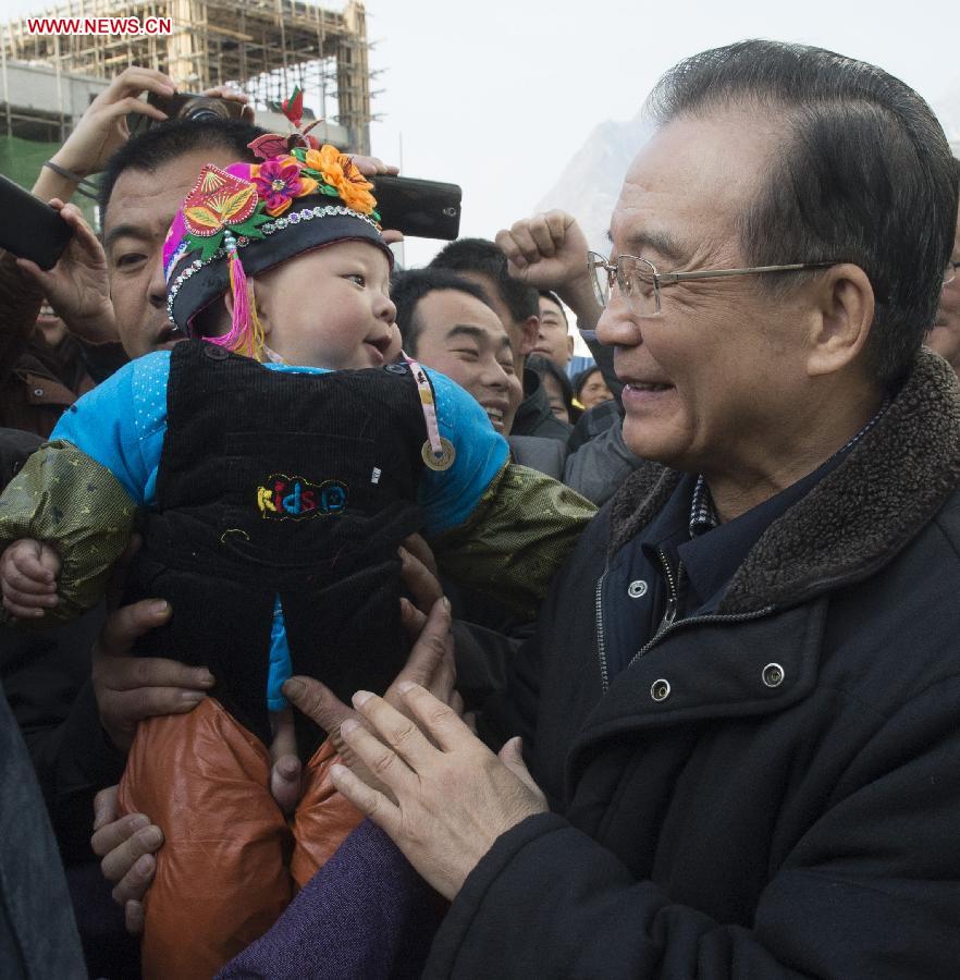 Chinese Premier Wen Jiabao (R) visits local residents in Zhouqu County, northwest China's Gansu Province, Feb. 9, 2013. Premier Wen made an inspection tour in Gansu and Shaanxi Province, also in northwest China, on Feb. 8-9. (Xinhua/Li Xueren)