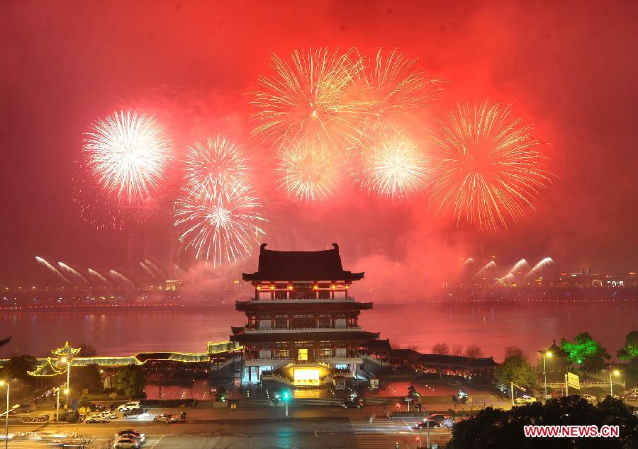 Fireworks paint the skyline at the Chinese Lunar New Year Eve over Changsha, capital of central China's Hunan Province, on Feb. 9, 2013. The Chinese Lunar New Year, or the Spring Festival, begins on Feb. 10 this year and marks the start of the Year of the Snake, according to the Chinese zodiac. (Xinhua/Long Hongtao)