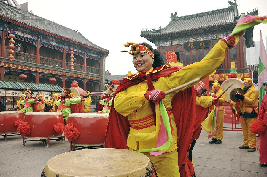 Folk artists perform at a local event celebrating Chinese Lunar New Year, or Spring Festival, in Tianjin, north China, Feb. 10, 2013. Various activities were held all over China on Sunday to celebrate the Spring Festival, marking the start of Chinese lunar Year of the snake. The Spring Festival falls on Feb. 10 this year. (Xinhua/Wang Xiaoming)