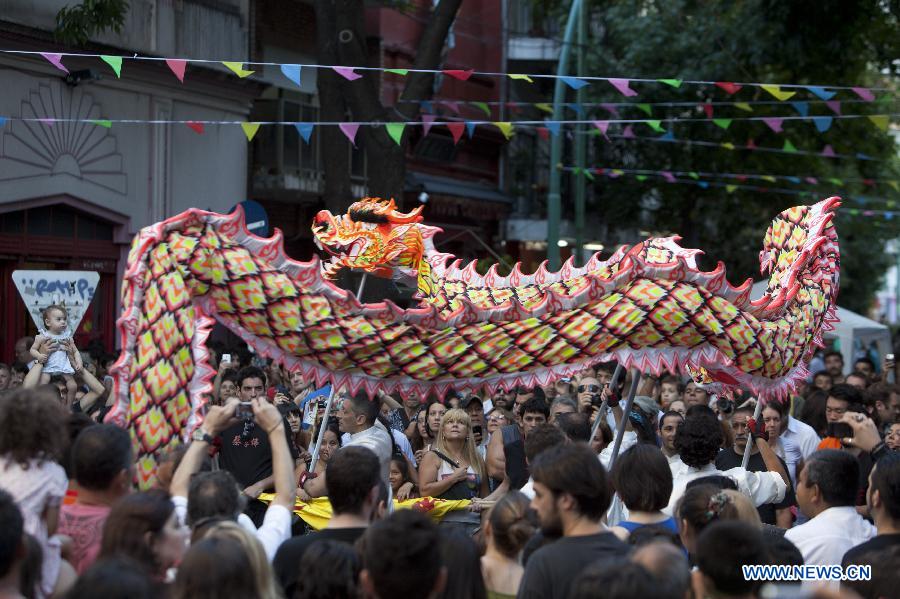 People perform dragon dance during a temple fair celebrating the upcoming Chinese Lunar New Year due on Feb. 10 this year, in Buenos Aires, capital of Argentina, Feb. 9, 2013. (Xinhua/Martin Zabala)