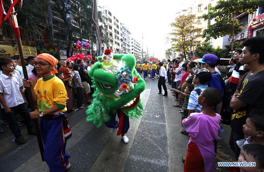 Actors perform lion dance at the Chinatown in Yangon, Myanmar, Feb. 9, 2013. A celebration was held Saturday at the Chinatown in Yangon for the upcoming Chinese Lunar New Year, which falls on Feb. 10 this year. (Xinhu/U Aung) 