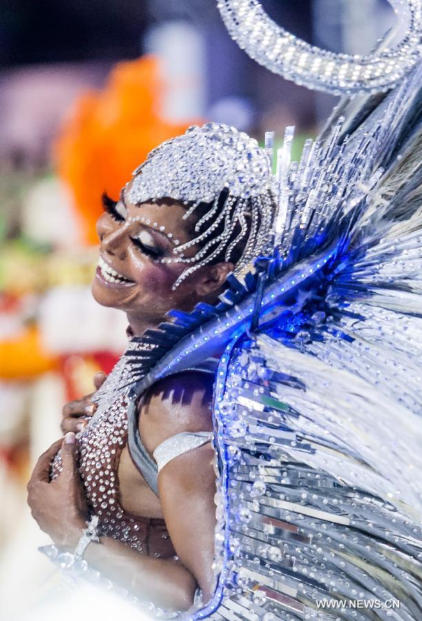 A dancer from the Nene da Vila Matilde Samba School performs during the carnival celebration, at the Sambadrome, in Sao Paulo, Brazil, on Feb. 9, 2013. (Xinhua/Marcos Mendez) 